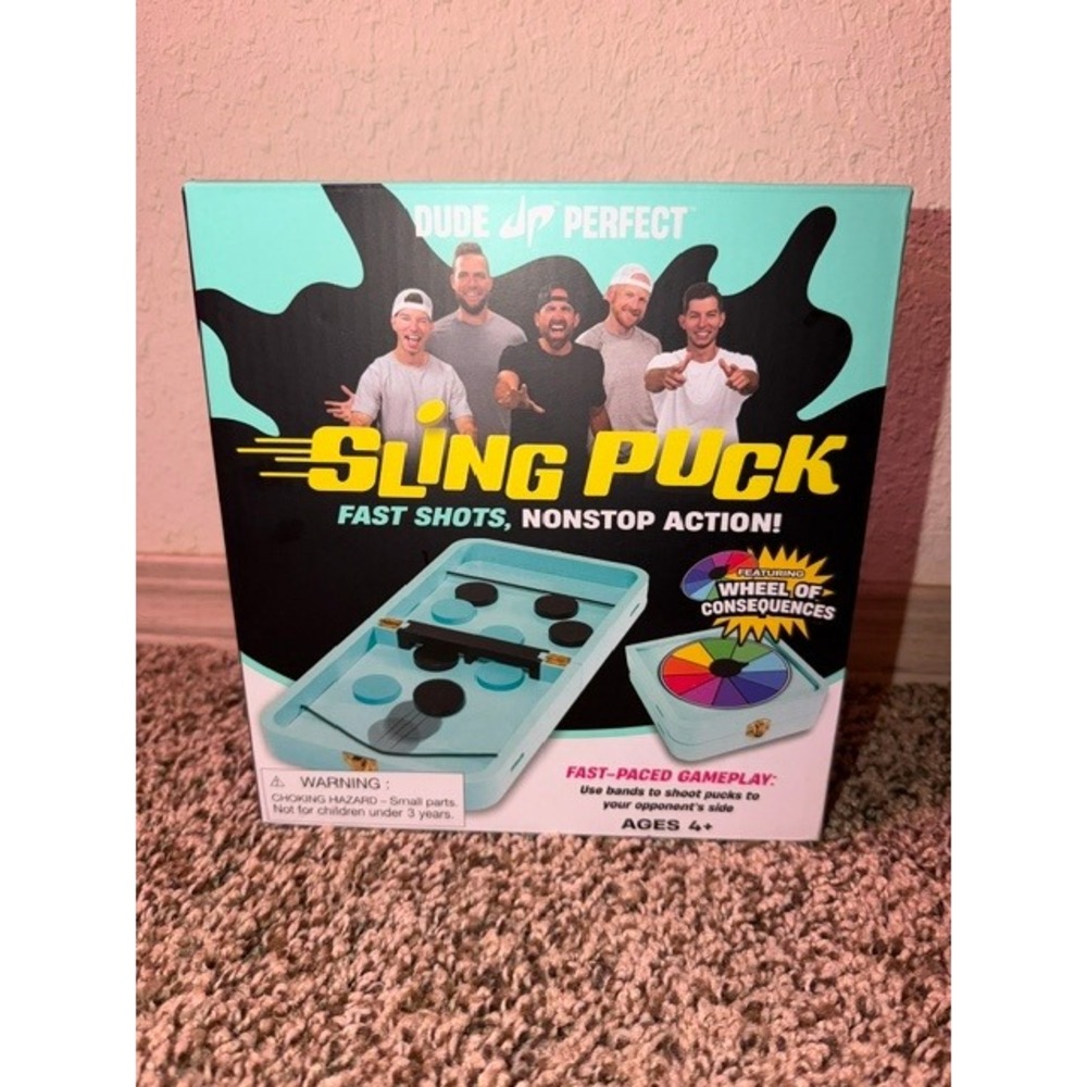 Dude Perfect Sling Puck Game 2-in-1 Checkers Wheel of Consequences Teal Black